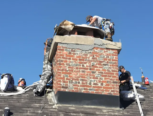 Harrisburg Chimney Sweep installing a custom chimney crown in Harrisburg, NC