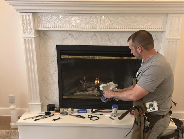 Harrisburg Chimney Sweep performing fireplace maintenance in Harrisburg, NC