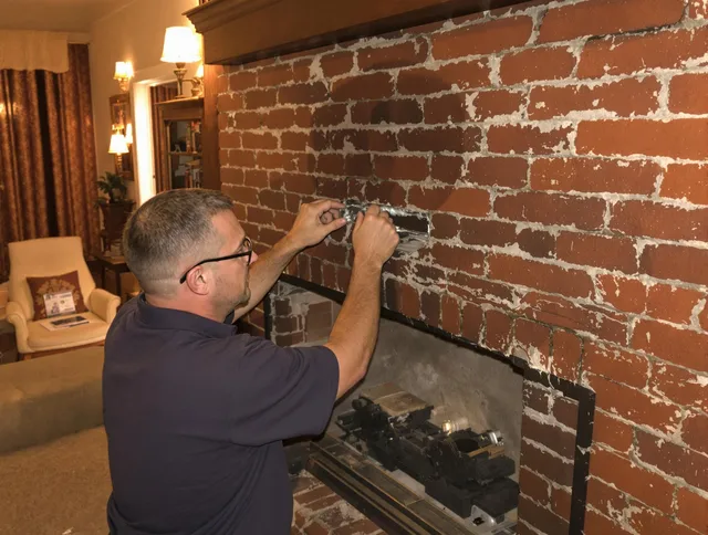 Harrisburg Chimney Sweep expert fixing a fireplace in Harrisburg, NC